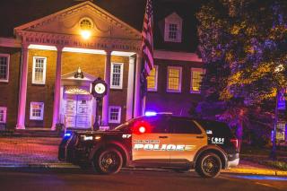 Police Vehicle in Front of House